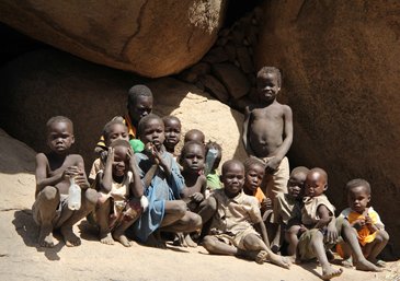 Because of the daily bombardments Nuba people live in the caves ...